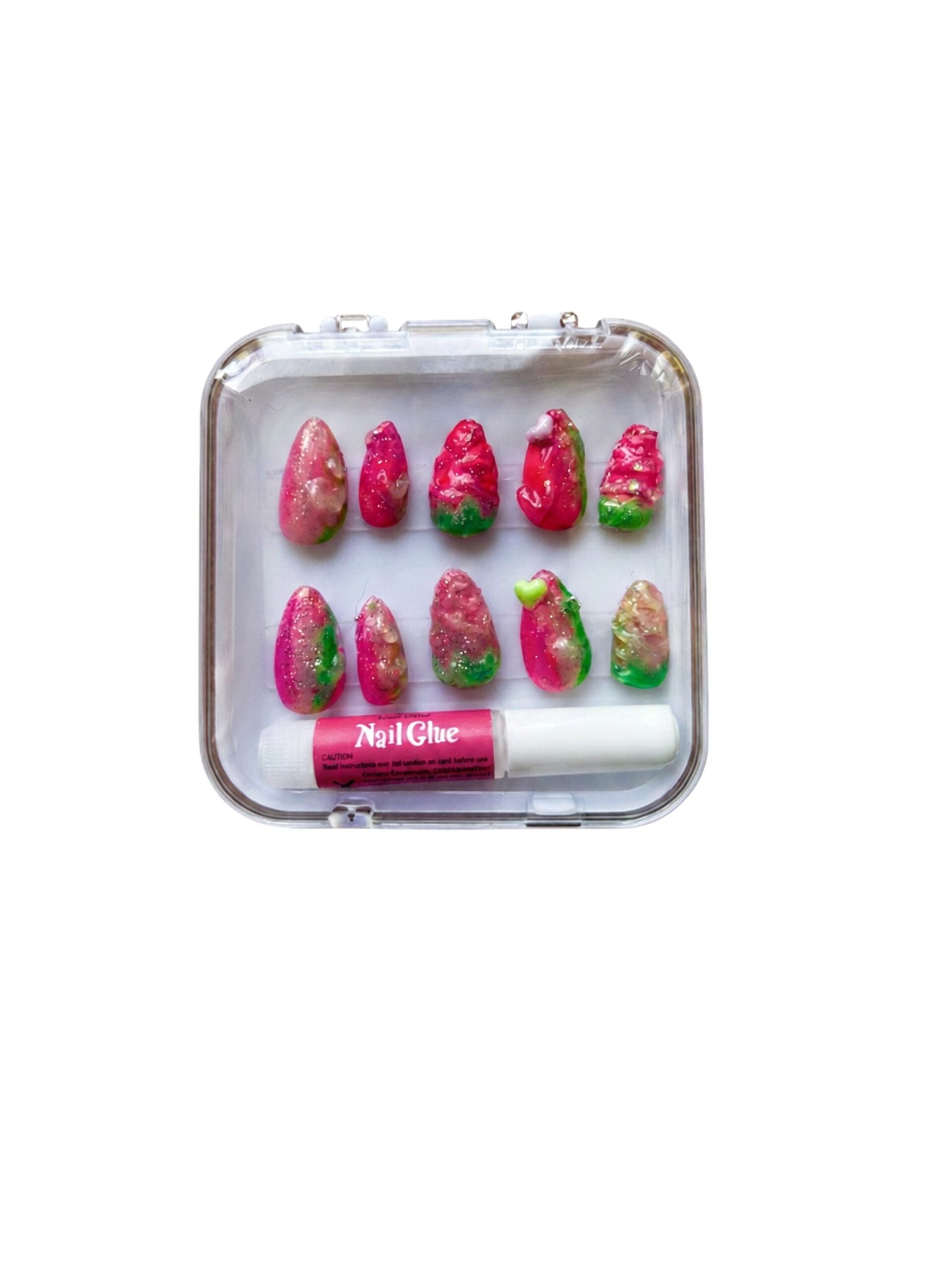 Clear plastic case containing several pink and green artificial nails and a bottle of nail glue inside.